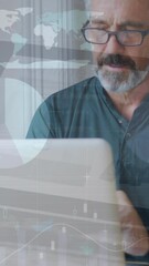 Poster - Animation of infographic interface over caucasian man wearing spectacles working on laptop