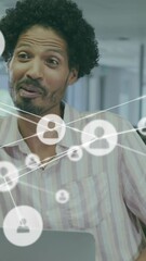 Poster - Animation of network of connections with icons over diverse business people in office