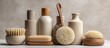 © jia - Various self care items for hygiene displayed with cosmetic bottles against a neutral background for adding text like a natural soap and circular massaging brush within the copy space image