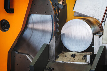 Poster - automatic circular saw cutting large metal part with round cross-section, industrial concept background.