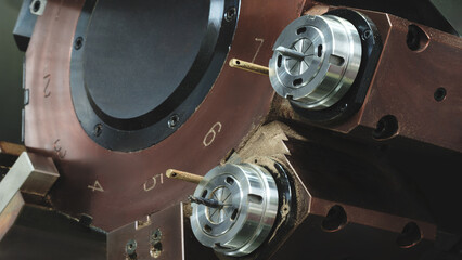Aufkleber - CNC Machine with a brown casing and a silver part.  machine is used for drilling. machine has a small hole in the middle