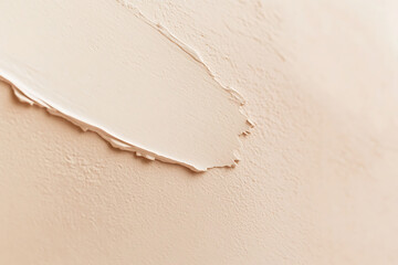 Poster - Beige background with a soft watercolor texture, close-up. The beige wall has a delicate gradient from light to dark tones. 