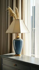 Poster - A beautifully designed lamp with a soft shade adds a touch of elegance to the room's decor and complements the natural light streaming in
