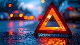 Red Emergency Triangle on Wet Road at Night