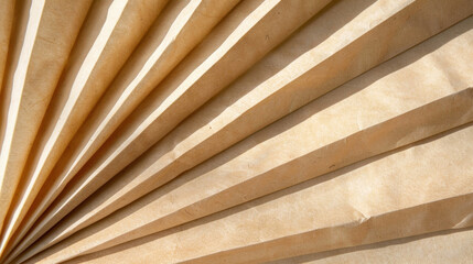  - Sunlit paper folds create natural margin, showcasing texture and layers of material. warm tones evoke sense of calm and creativity, perfect for artistic projects