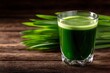 © Bundi - A glass of fresh barleygrass accompanied by young barley grass juice