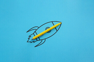 Poster - Creativity inspiration ideas concept is shown by yellow pen with outline rocket on blue paper background