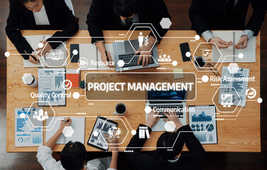 Poster - A bird-eye view of a team engaged in project management, highlighting collaboration, planning, and data-driven decisions in a contemporary office setting. Amity
