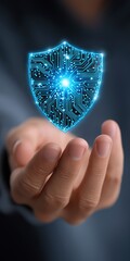 Poster - A hand holding a blue shield with a glowing light inside. The shield is a symbol of protection and security