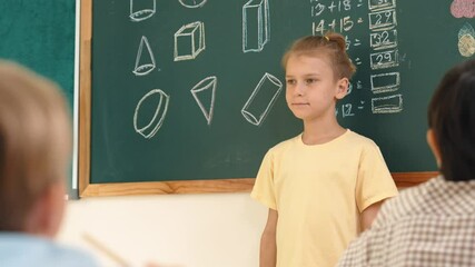 Poster - Caucasian boy talking and present idea while standing in front of blackboard with Math theory written. Diverse cute student sitting while looking at new student introduce himself. Education. Pedagogy.