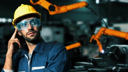 Poster - Engineer use cybernated robotic software to control industry robot arm in factory . Automation manufacturing process controlled by specialist using IOT software connected to internet network .