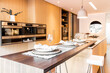 © ADDICTIVE STOCK - Modern kitchen with elegant design and warm tones