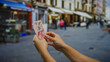 © Krakenimages.com - Man holding mexican pesos on a bustling urban street, highlighting currency, business, and investment in a vibrant city atmosphere.