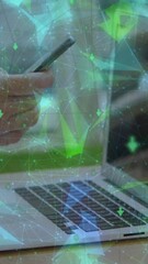 Poster - Globe of plexus network spinning against mid section of man with laptop using smartphone
