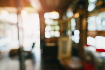Poster - Blurry Background of Cozy Coffee Shop Interior with Soft Natural Light and Warm Atmosphere