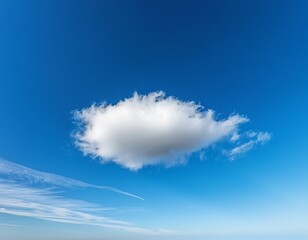 Wall Mural - delicate white cloud with a pointed tip and wispy extensions drifts in a clear blue sky creating a serene and light natural background