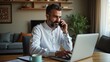 © Valentina - Mature man working remotely from home on laptop and having a phone call Muslim business. Authentic Arabian style.