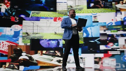Poster - African american specialist engaging with media dashboards screens, emphasizes networking with AI and technology. Tech driven guy showcases online platforms and internet communication. Camera A.