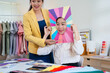 © Fahng - Young Asian woman doing personal color diagnosis by Face frames Color Season Kit for determining skin undertone and seasonal color palette. Beauty advisor.