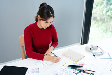 Fototapete - Mobile application design. Creation of sketch of application interface. web designer. UX Designer draws apps on paper. Web architect at  desk.