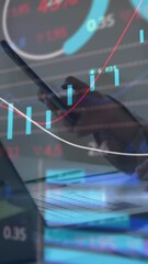Poster - Animation of graphs and trading board over midsection of caucasian woman using laptop and cellphone