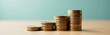 © Deborah - pile coins accumulating earnings grow allowing increased savings