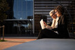 © Cavan Images - Businesswomen working with laptop in barcelona, spain