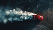 © Chanoknan - Car drifting on a race track showing tire smoke and dynamic movement overhead view in vibrant red color