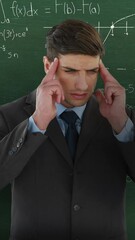 Poster - Man thinking in front of moving maths calculations on chalkboard 4k