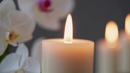 Aufkleber - Soft candlelight gently bathing delicate white orchid blossoms, radiating soothing zen like tranquility and creating peaceful wellness atmosphere for relaxation and inner harmony