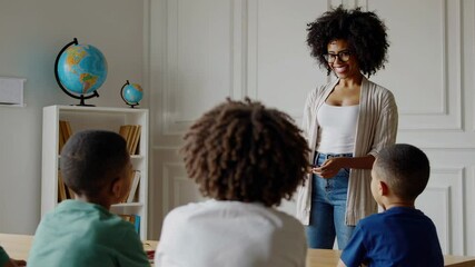 Poster - Dedicated african american educator interacting with elementary students. Creating engaging learning environment while fostering positive educational relationships and motivational classroom dynamics
