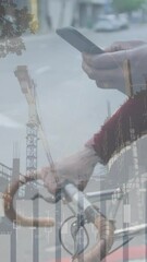 Poster - Animation of financial data processing over african american man with smartphone on the go