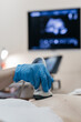 © Vladislav - Young pregnant woman undergoing ultrasound diagnosis at clinic. Concept early pregnancy monitoring and fetal health