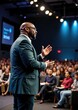 © Ilya - African-american male speaker engages audience at business conference presentation