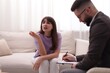 © New Africa - Professional psychologist working with patient in office