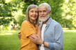 © New Africa - Lovely senior couple walking together in park
