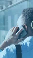Poster - Animation of changing numbers, multiple icons over man talking while walking in office