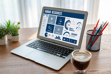 Fototapete - Human resources management software on computer screen helping human resources employee to manage recruitment, payroll, staff searching and KPI evaluation snugly