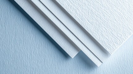 Poster - Textured white paper sheets layering diagonally across pale blue surface, forming minimalist geometric pattern with crisp linear contrast and subtle textural depth