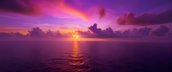 Wall Mural - Bright tropical sunset with vivid pink purple and orange clouds over calm serene sea