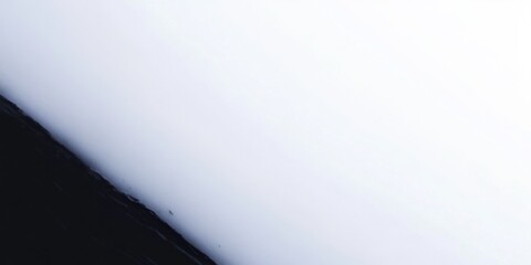 Poster - Abstract black and white background with diagonal line dividing dark and light areas. Minimalist contrast for modern design.