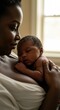 © Mauricio - A loving african american mother holds her newborn baby close to her chest