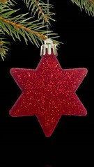 Poster - Animation of christmas tree with red stars and fairy lights flickering over black background