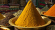 © Andre Bimbatti - Turmeric powder in vibrant market dish
