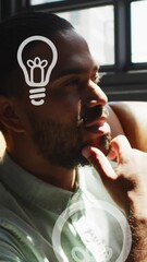 Poster - Animation of lightbulb icons over businessman thinking