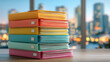 © chatchawan - Stack of colorful folders filled with paperwork sits on wooden desk against blurred cityscape background, creating vibrant and organized office scene