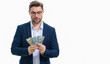 © Volodymyr - Man with hundred dollar bill, dollars banknotes. Man holding lots of 100 dollar bills. Easy money credit. Payday and payment concept. Profit and richness. Earn money. Businessman successful deal.