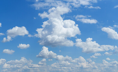 Wall Mural - a beautiful blue sky with soft white clouds for abstract background