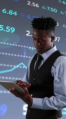 Poster - Animation of financial data processing over african american businessman using tablet