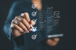 © Nirusmee - Checklist business performance monitoring concept, Businessman using tablet online survey filling out check digital form task, survey question form, target marketing planning with quality control